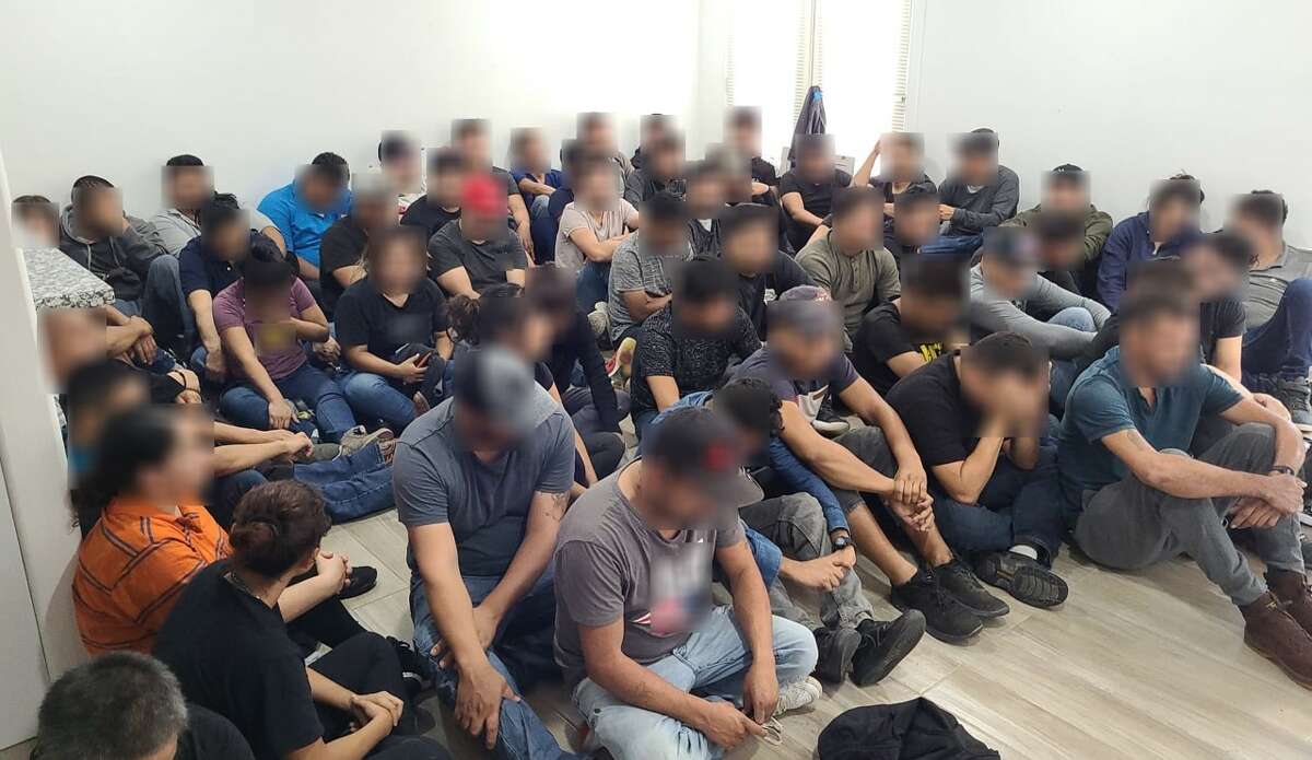 Federal and county authorities apprehended 60 migrants following a traffic stop that led them to a stash house on East Calton Road.