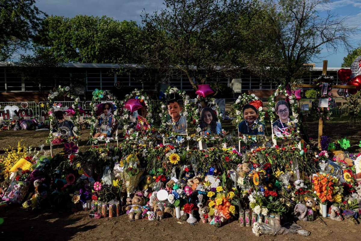 Early morning light shines on the massive memorial outside of Robb Elementary School, where 19 children and two teachers were murdered May 24. The community still seeks answers, and the Express-News, through its reporting and contribution to United with Uvalde, stands with it.