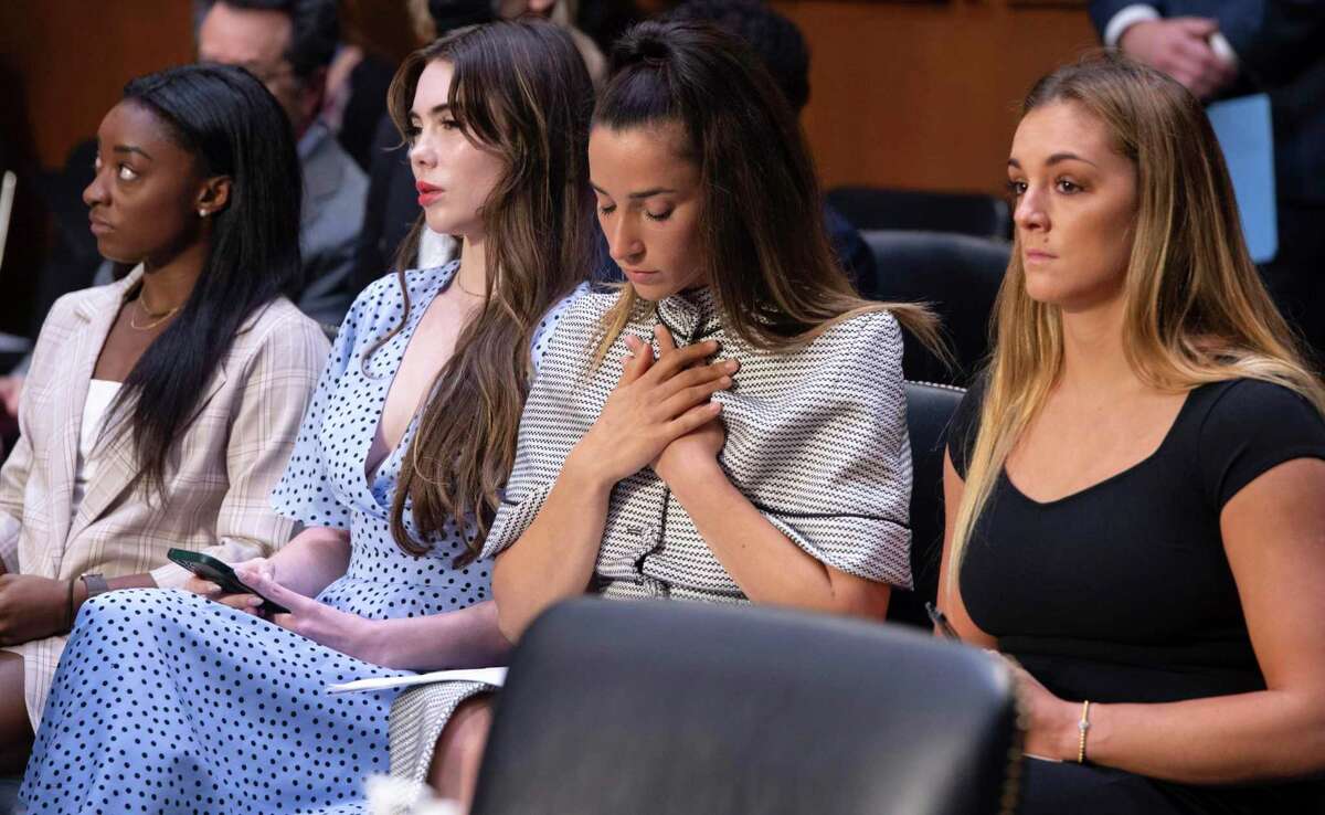FILE - United States gymnasts from left, Simone Biles, McKayla Maroney, Aly Raisman and Maggie Nichols, arrive to testify during a Senate Judiciary hearing about the Inspector General's report on the FBI's handling of the Larry Nassar investigation on Capitol Hill, Wednesday, Sept. 15, 2021, in Washington. Olympic gold medalist Simone Biles and dozens of other women who say they were sexually assaulted by Larry Nassar are seeking more than $1 billion from the FBI for failing to stop the now convicted sports doctor when the agency first received allegations against him, lawyers said Wednesday, June 8, 2022. (Saul Loeb/Pool via AP, File)