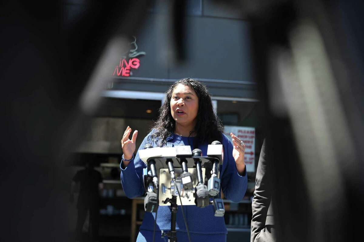 Mayor London Breed talks to the media during a walk with Supervisor Matt Dorsey in the design district to discuss economic recovery efforts.