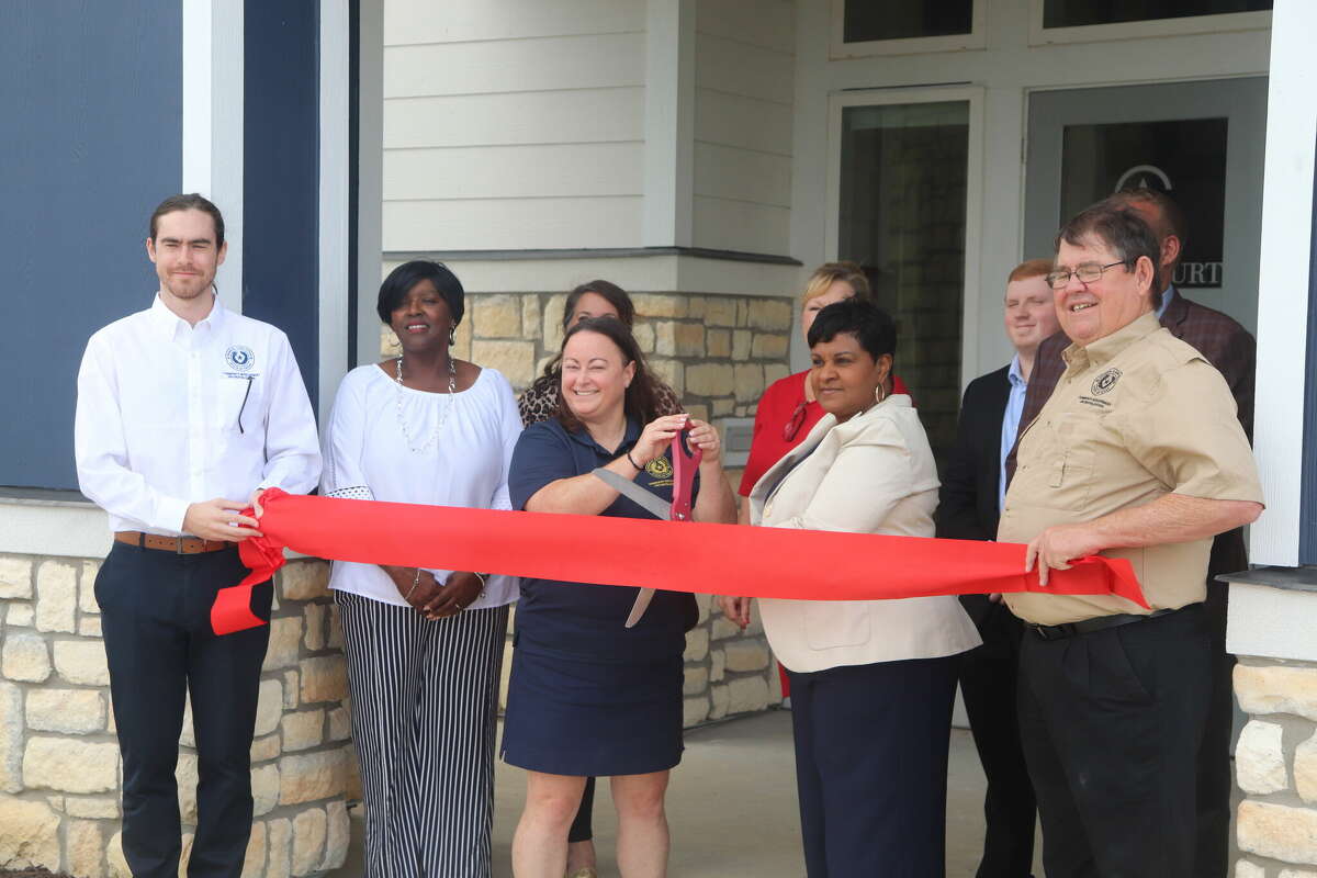 Members of the Texas General Land Office disaster recovery team on Wednesday celebrated the opening of Abby Court, a new affordable housing complex on Folsom Drive.