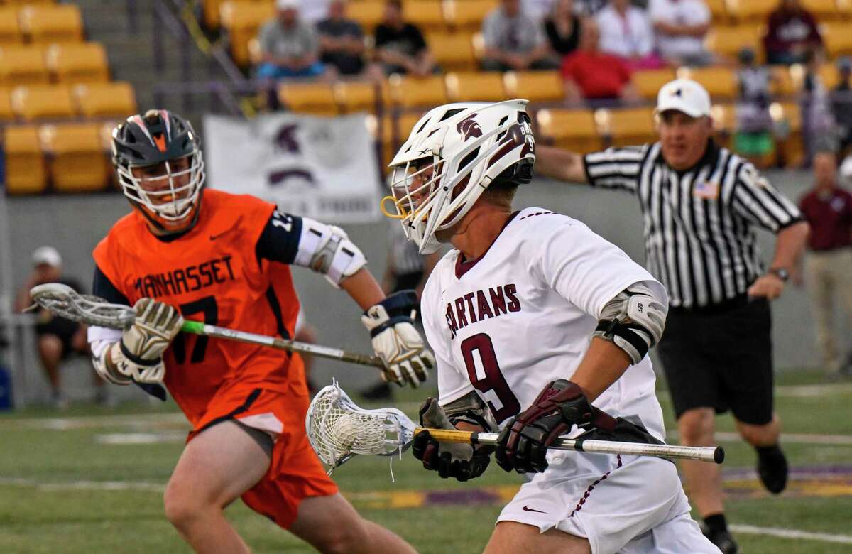 Burnt Hills-Ballston Lake's Rocco Mareno (9) moves the ball against Manhasset during the Class C New York State High Public School boys’ lacrosse East state semifinal game. Wednesday, June 8, 2022, in Albany, N.Y. (Photo/Hans Pennink)