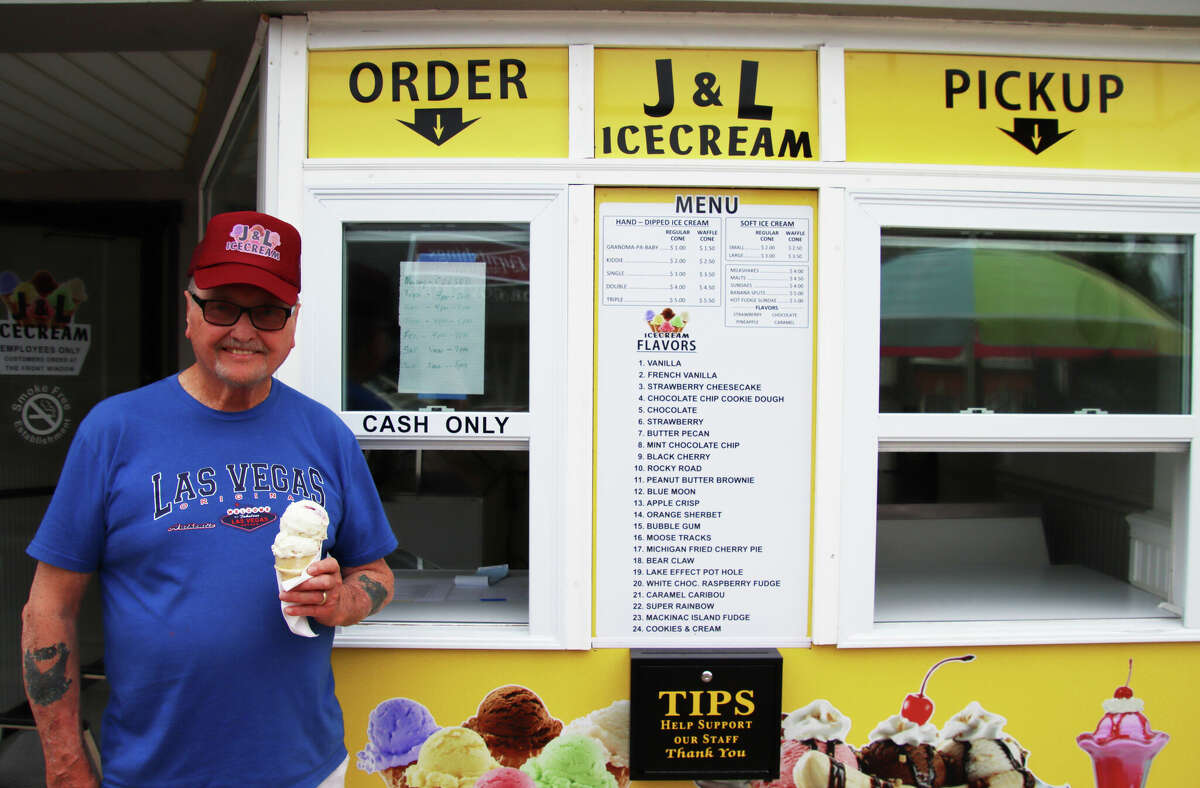 J&L Ice Cream on Huron Avenue in downtown Bad Axe is now open for business. Above, J&L owner Jim Hicks serves up a double scoop of Michigan Fried Cherry Pie in a regular cone.