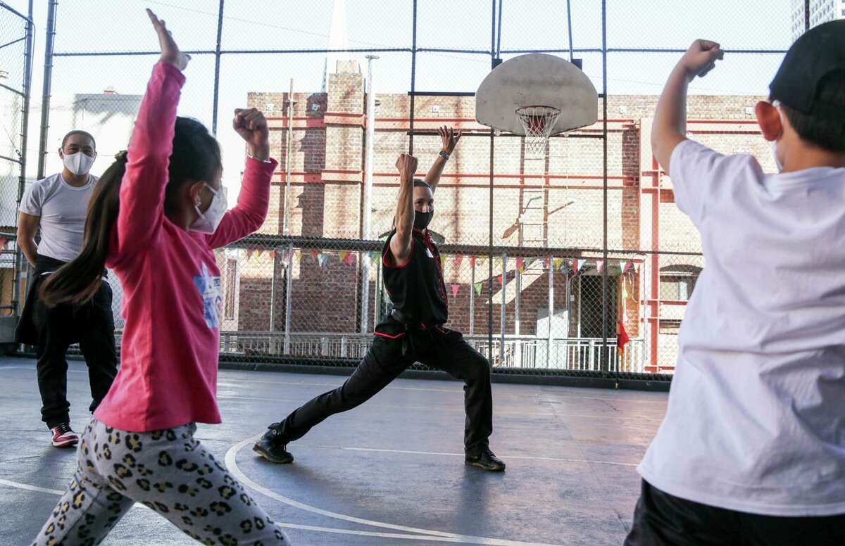 Justin Hoover teaches a martial arts class to kids in Chinatown: “It’s not about punching and fighting,” he says “It’s about standing and just meditating. It’s about breathing.”