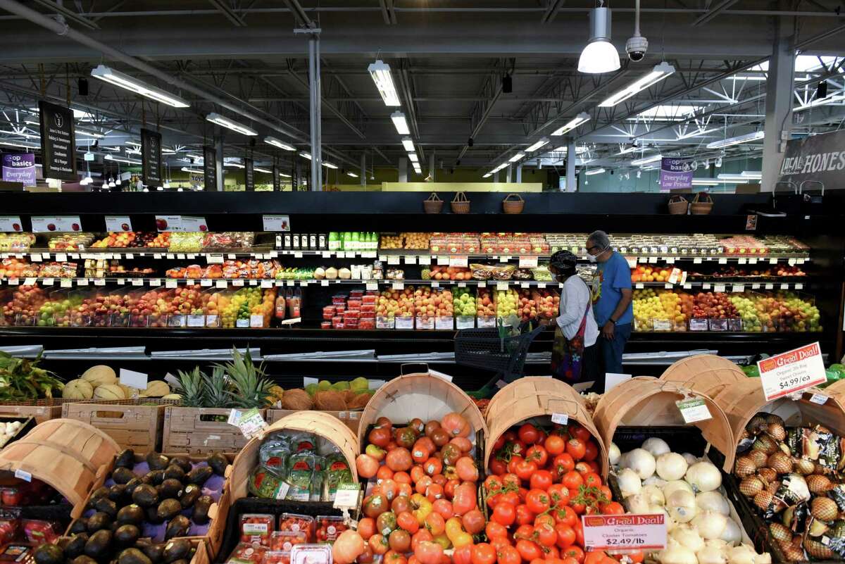Customers shop for produce at Honest Weight Food Co-op on Wednesday, June 8, 2022, in Albany, N.Y. Consumers are altering their shopping habits amid rising prices and inflation.
