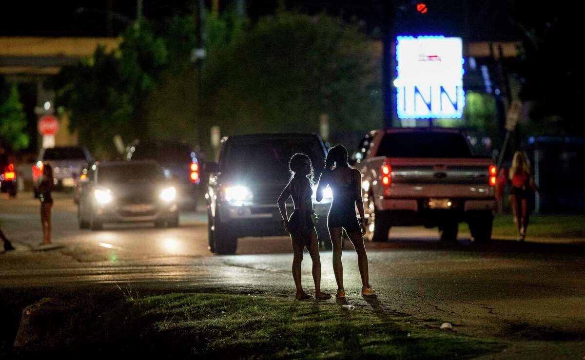 Women stand at Ponderosa Lane and Plainfield Street in a Houston area known as the Bissonnet Track, which is a notorious hot spot for sex trafficking and prostitution, Thursday, Sept. 6, 2018.