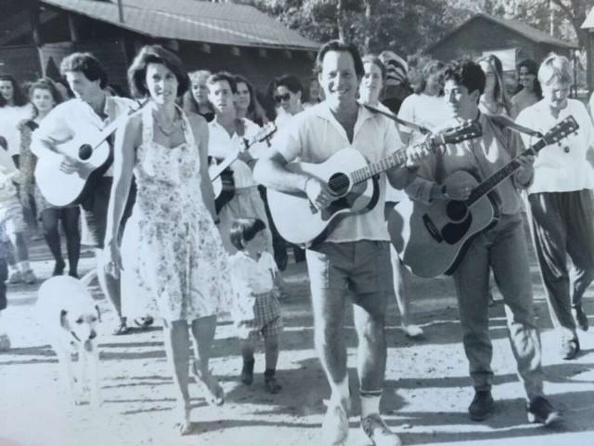 Ken Kramarz leading the Shabat Stroll at Camp Tawonga, in 1991. At left is his wife, Felicia, with their son Jake.