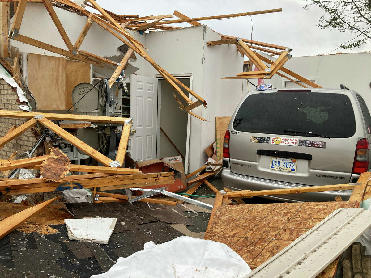 Damage is seen at the home of Betty Wisniewski after a tornado came through the area in Gaylord, Mich., Friday, May 20, 2022. Wisniewski's son said she escaped unharmed.  