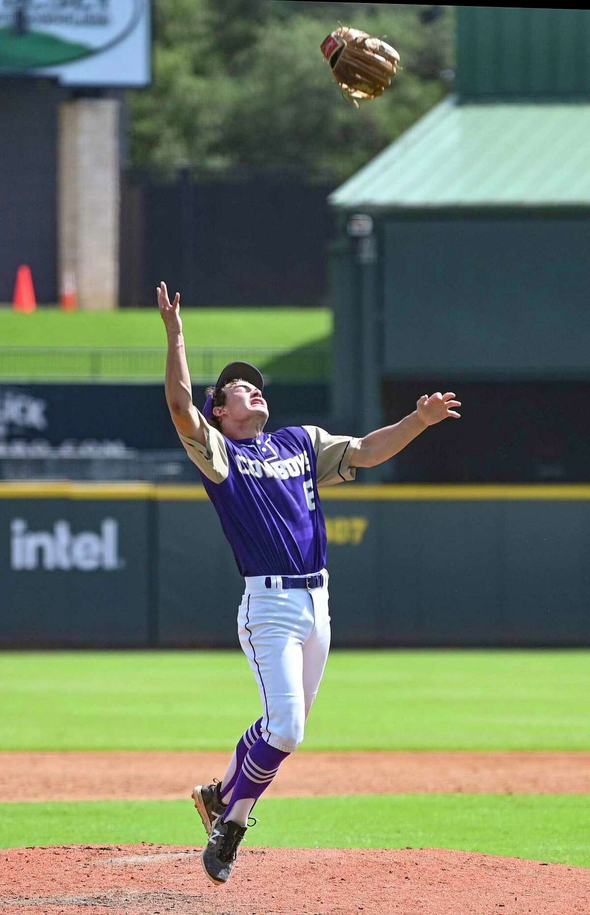 D’Hanis pitcher Ryan Hendry tosses his glove in jubilation after the Cowboys defeated Nazareth, 4-0, to win the UIL state Class 1A championship at Dell Diamond in Round Rock on Thursday, June 9, 2022.