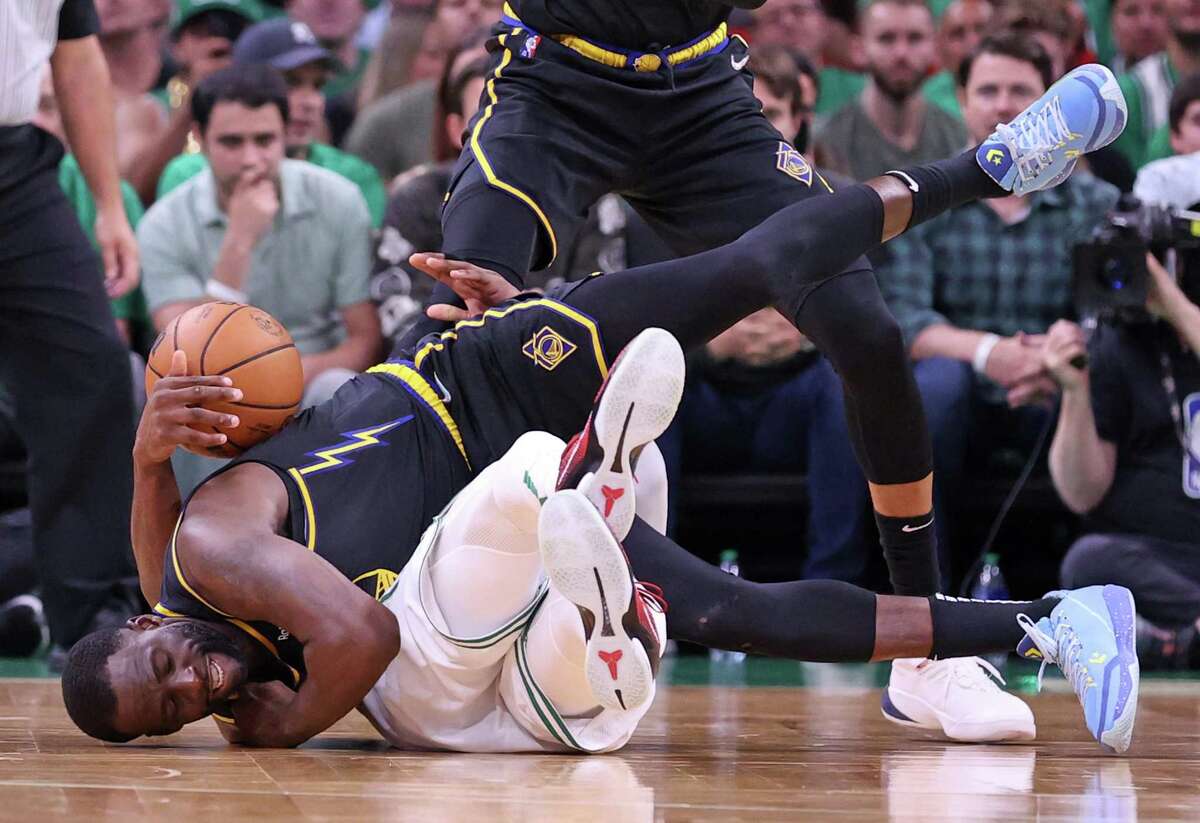 Golden State Warriors’ Draymond Green commits a foul on Boston Celtics’ Jaylen Brown in 3rd quarter of Celtics’ 116-100 win during Game 3 of NBA Finals at TD Garden in Boston, Massachusetts, on Wednesday, June 8, 2022.