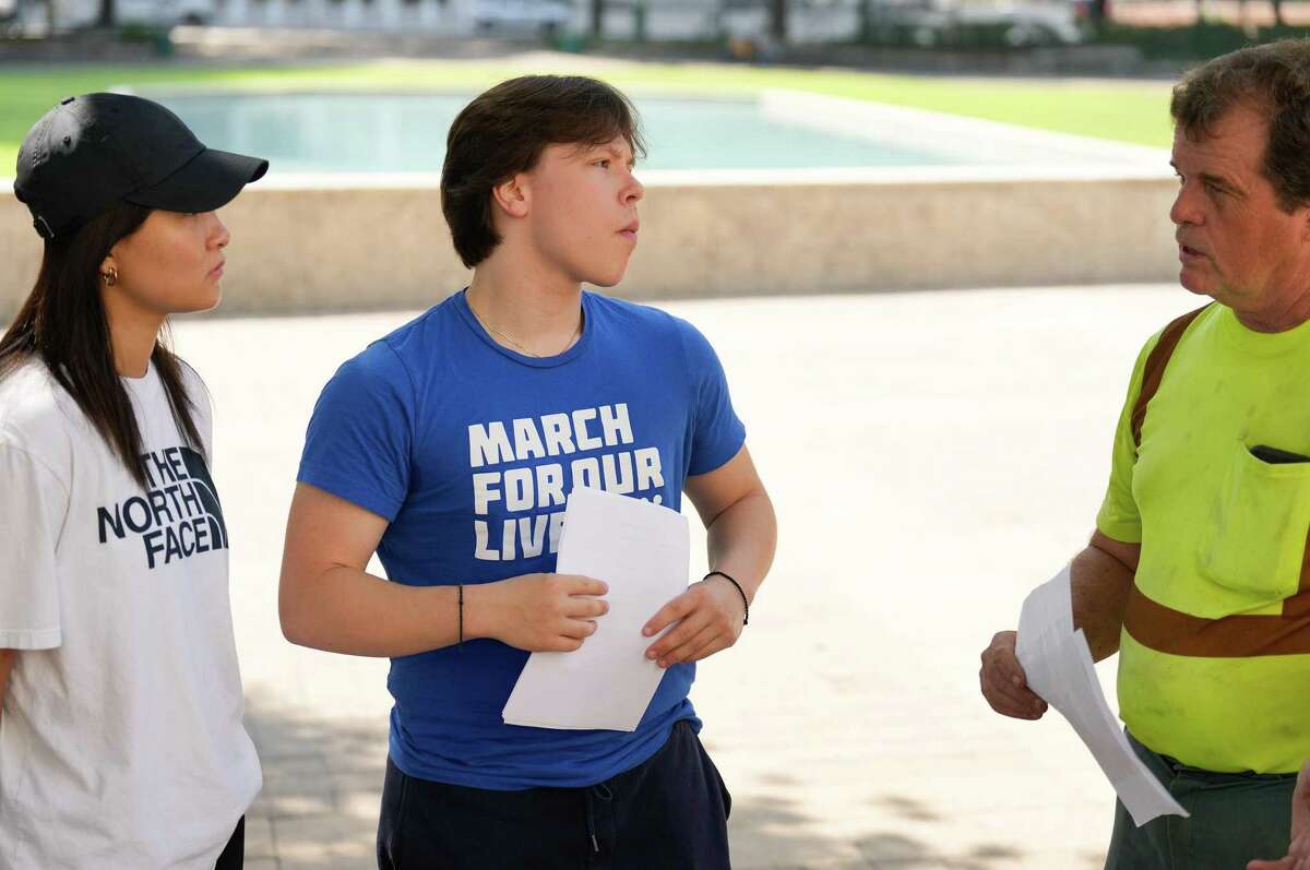 Houston chapter of March for Our Lives members Katherine Chen and George Tataris talk to Phillip Jennings, assistant superintendent for Houston Parks, as they plan on Thursday, June 9, 2022 for a rally to be held at Houston City Hall on Saturday.