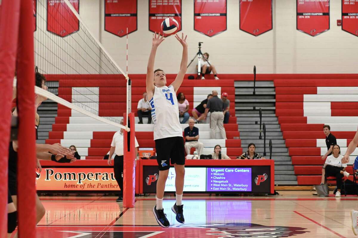 Griffith Crouse of Darien sets a pass during the CIAC Class L Boys Volleyball Championship against the Trumbull Eagle on Thursday June 9, 2022 at Pomperaug High School in Southbury, CT.