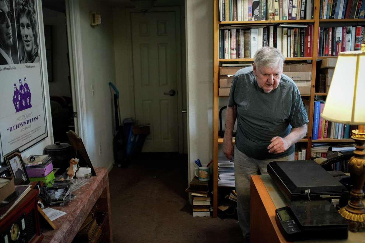 Larry Lingle, 85, talks about his life and books and photographs he collects and sells Thursday, June 9, 2022, at his apartment in Houston.