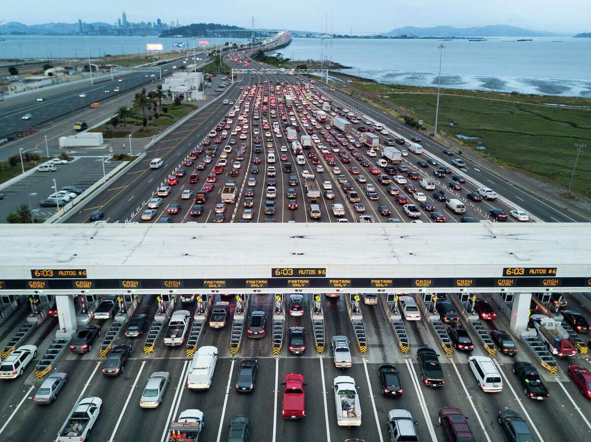 Traffic flows through the Bay Bridge toll plaza on Thursday, June 8, 2017, in Oakland, Calif.