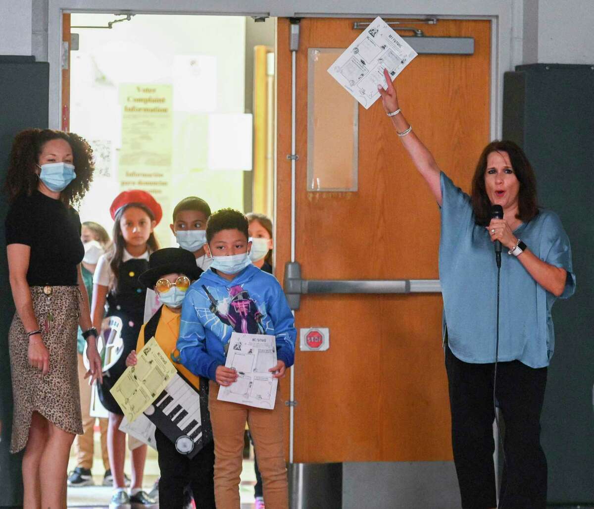 Jeanette Zuniga, a school counselor at Maverick Elementary, runs a fashion show for her students in May. Even retired teachers came in to help, because when Zuniga dreams up a project, they know it’s worth the effort.