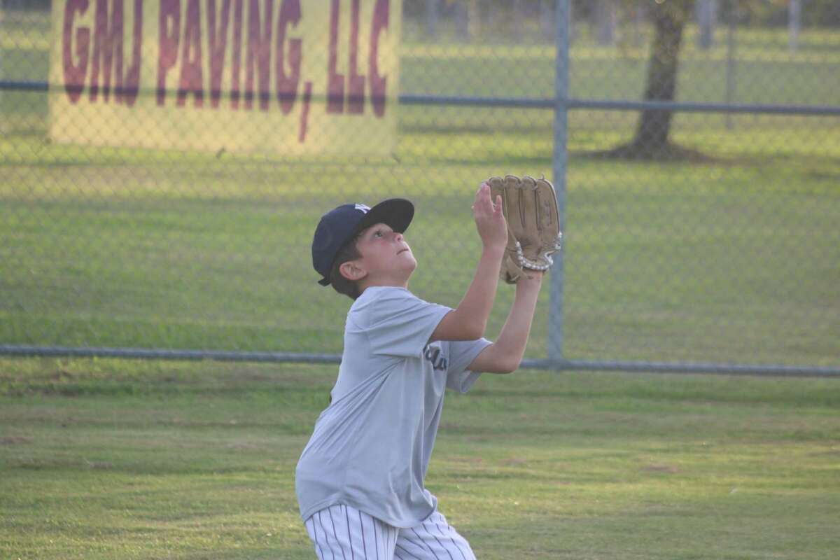 Because this Mustang all-star was using two hands to catch fly balls, he didn't hear his coaches yell, "Two hands, please."