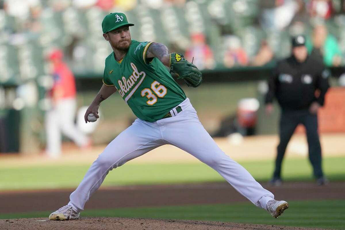 Oakland Athletics' Adam Oller pitches against the Los Angeles Angels during the first inning of the second baseball game of a doubleheader in Oakland, Calif., Saturday, May 14, 2022. (AP Photo/Jeff Chiu)