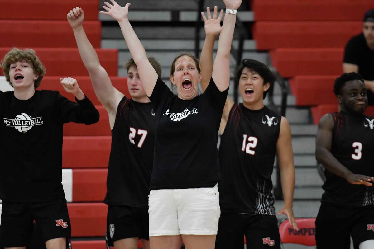 New Canaan Head Coach Amy Warren reacts to a point during the CIAC Class M Boys Volleyball Championship against Joel Barlow on Thursday June 9, 2022 at Pomperaug High School in Southbury, CT.