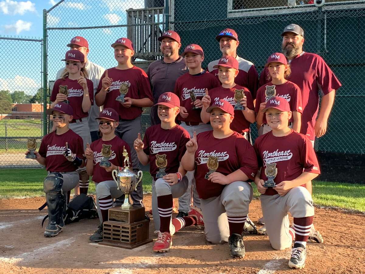 The Wilson Miller Little League baseball team poses with the championship trophy after beating Feeny 7-2 in Thursday's major (11-12-year-old) city final at Wilson Field, June 9, 2022.