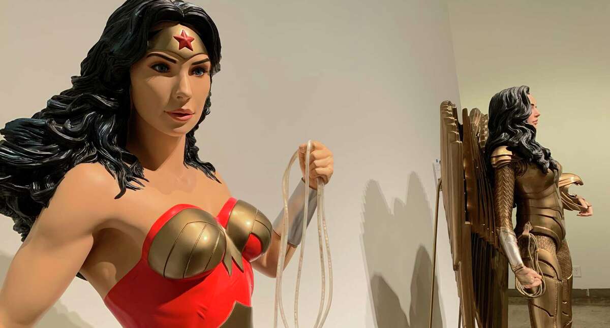 Statues of Wonder Woman, shown in her classic costume (left) and in her gold armor from "Wonder Woman 1984" (right), are part of "Tony Parker's Heroes and Villains," a new exhibit at San Antonio Museum of Art featuring pop culture statues from the former Spurs player's private collection. "Heroes and Villains" runs through Sept. 4.