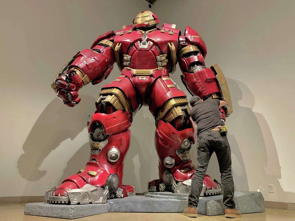 San Antonio Museum of Art lead preparator Nick Hay inspects a Hulkbuster statue for "Tony Parker's Heroes and Villains," a new exhibit at the museum featuring pop culture statues from the former Spurs player's private collection. "Heroes and Villains" runs through Sept. 4.