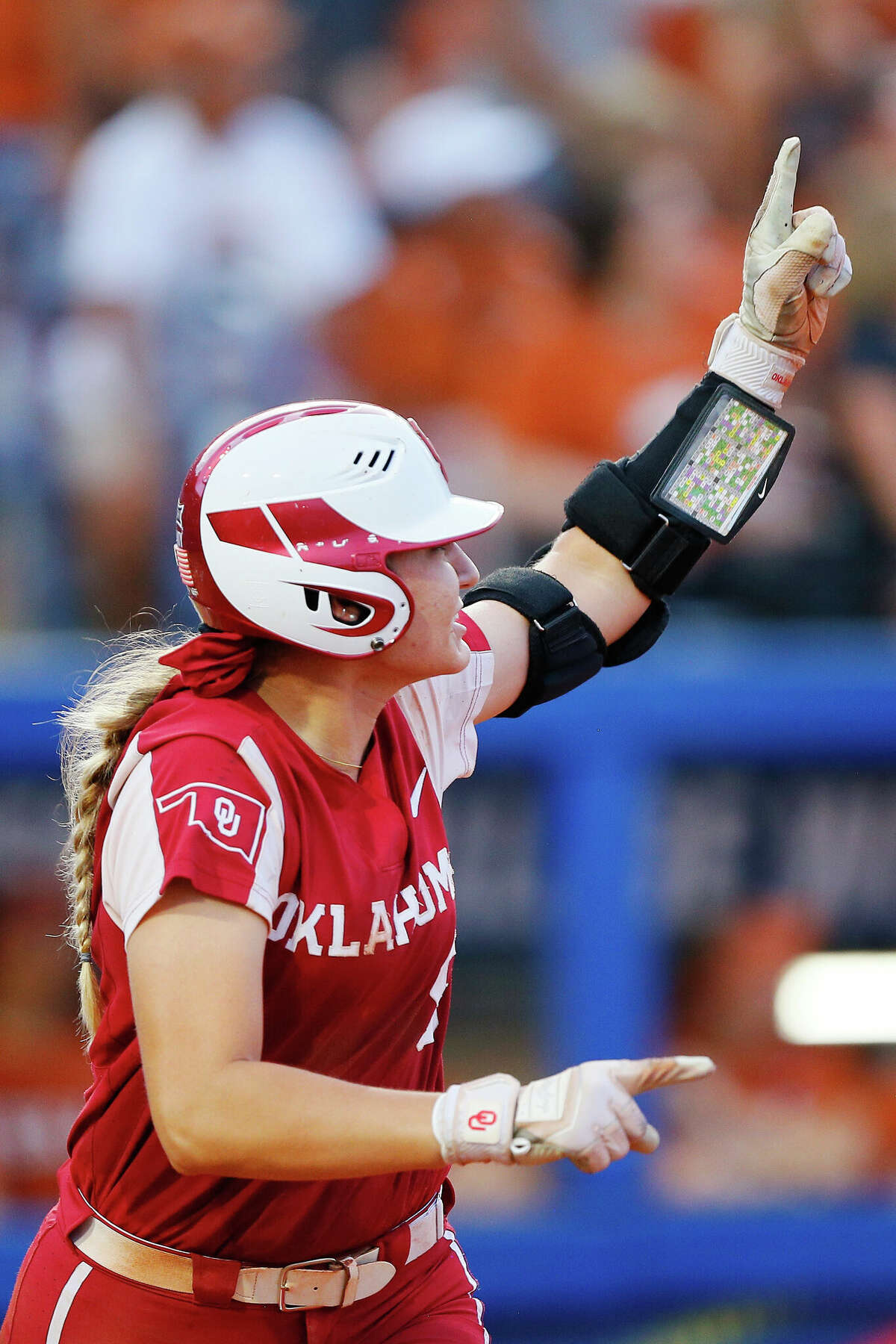 OKLAHOMA CITY, OK - JUNE 9: Kinzie Hansen #9 of the Oklahoma Sooners celebrates as she watches her three-run home run clear the wall against the Texas Longhorns in the fifth inning during the NCAA Women's College World Series finals at the USA Softball Hall of Fame Complex on June 9, 2022 in Oklahoma City, Oklahoma. Oklahoma leads 10-2 in the sixth inning. (Photo by Brian Bahr/Getty Images)