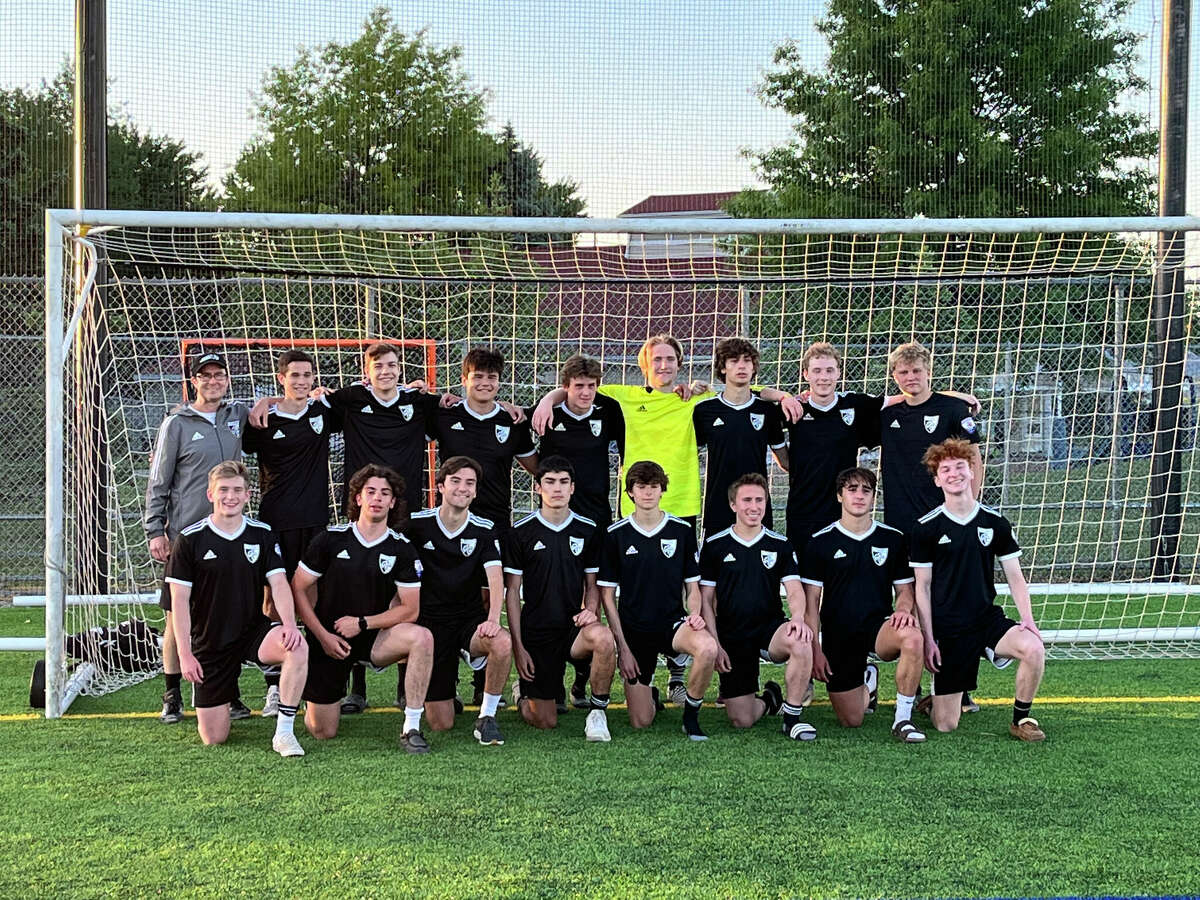 Members of the Midland Fusion ’04 boys’ soccer team which won the 2022 Michigan Premier 1 championship are (front, from left) Michael Brookens, Carson Snyder, Caleb Pinkerton, Drew Soto, Jonah Dahn, Luke Martin, Gerrit Barth, Brennan Mahokey; and (back, from left) coach Doug Dahn, Tyler Sanchez, Porter Baker, Justin Schafer, Isaac Skinner, Chip Shumaker, Lance Coleman, Jack Wolohan, and Brenden Dore.Not pictured are River Penn and Nathan Niederquell.