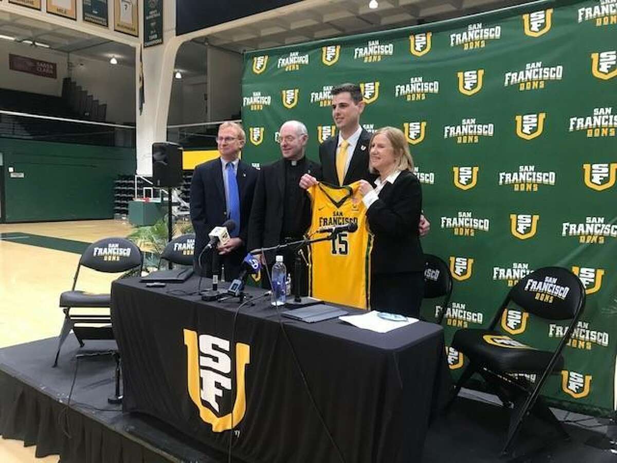 Athletic director Joan McDermott (far right) hired Todd Golden (second from right) as USF’s men’s basketball coach. Golden led the Dons to the NCAA Tournament this past season, the school’s first NCAA berth since 1998. From left, USF provost Don Heller and school president Paul Fitzgerald are alongside Golden and McDermott.