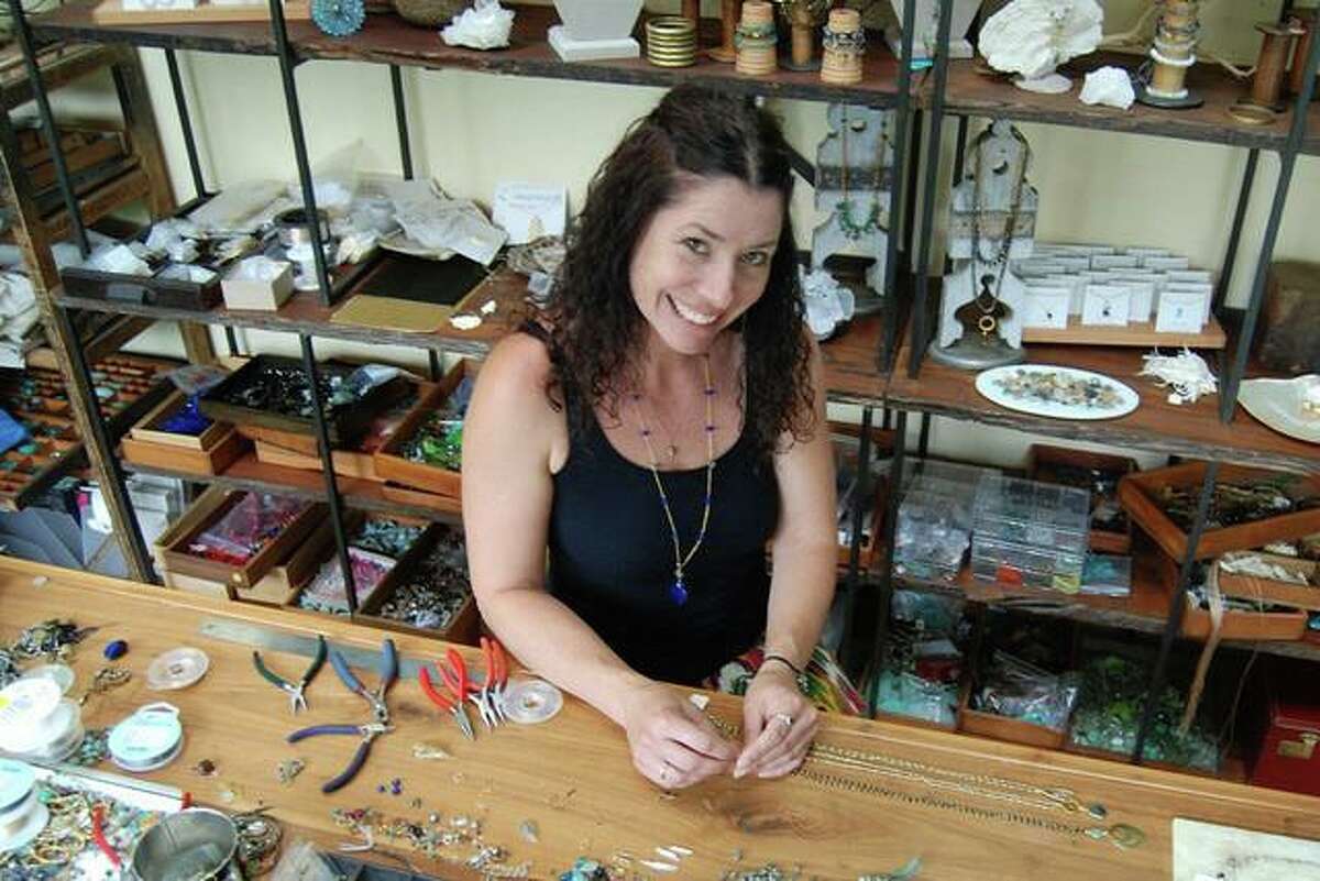 Jewelry maker Susan Roberts of Branford in her studio. At top, Strange Charm Glass, with creations inspired by traditional motifs, nature, holiday décor and pop culture, will be at the Saturday, July 30 GAC Pop-Up Series.