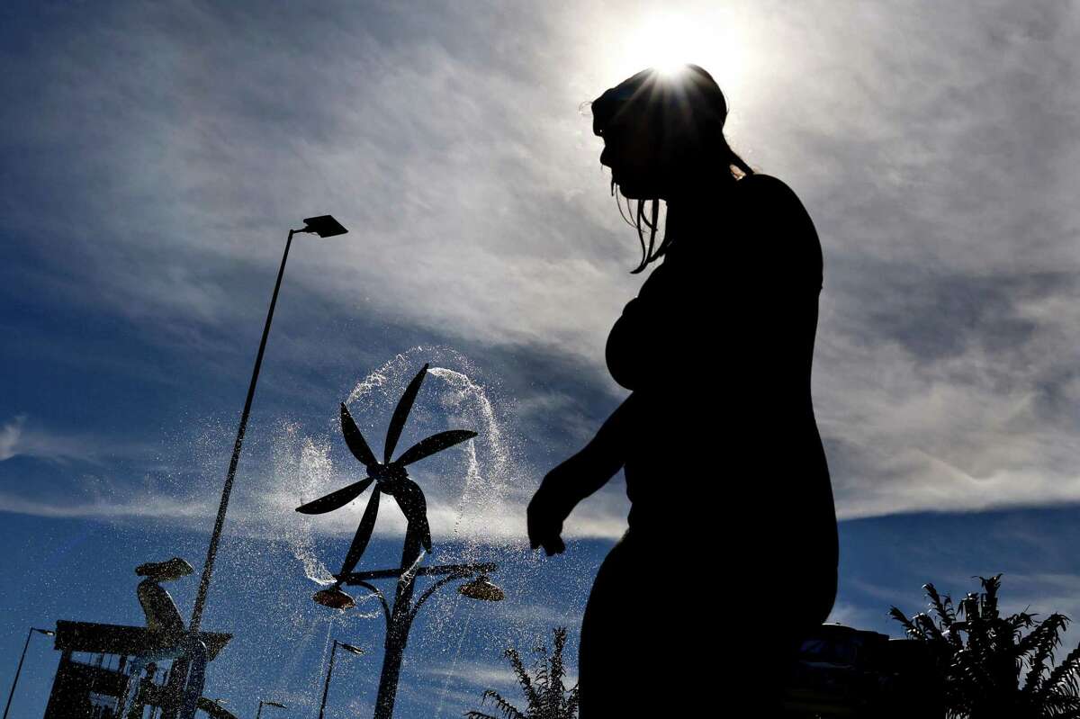 A woman looks for relief from the heat at the Wave Waterpark in Dublin during last week’s heat wave.
