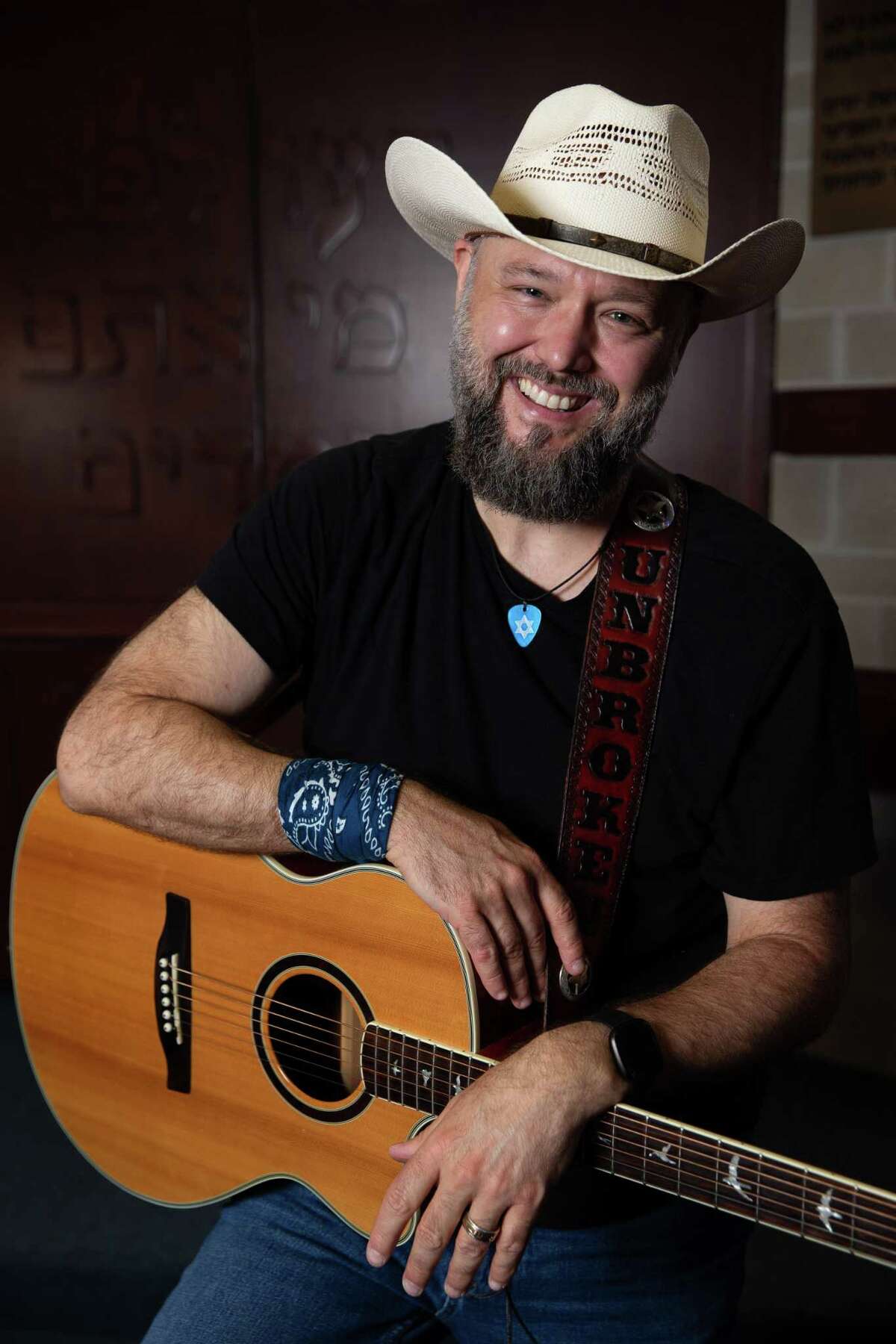 Country singer Joe Buchanan poses for a photograph at Congregation Shaar Hashalom, where he converted to Judaism, Tuesday, June 7, 2022, in Houston. Buchanan has a Jewish theme to his songs. He used songwriting to understand the new-to-him religious tenets.