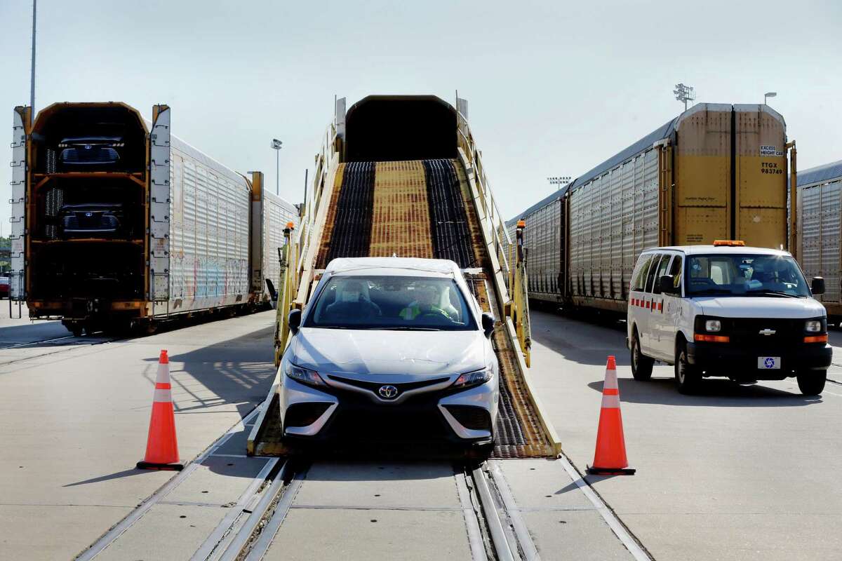 New Toyota Camrys are driven off rail cars to be made ready before going to dealerships at the Friedkin Group Gulf States Toyota processing facility. Friedkin topped the Chronicle 100’s list of private companies.