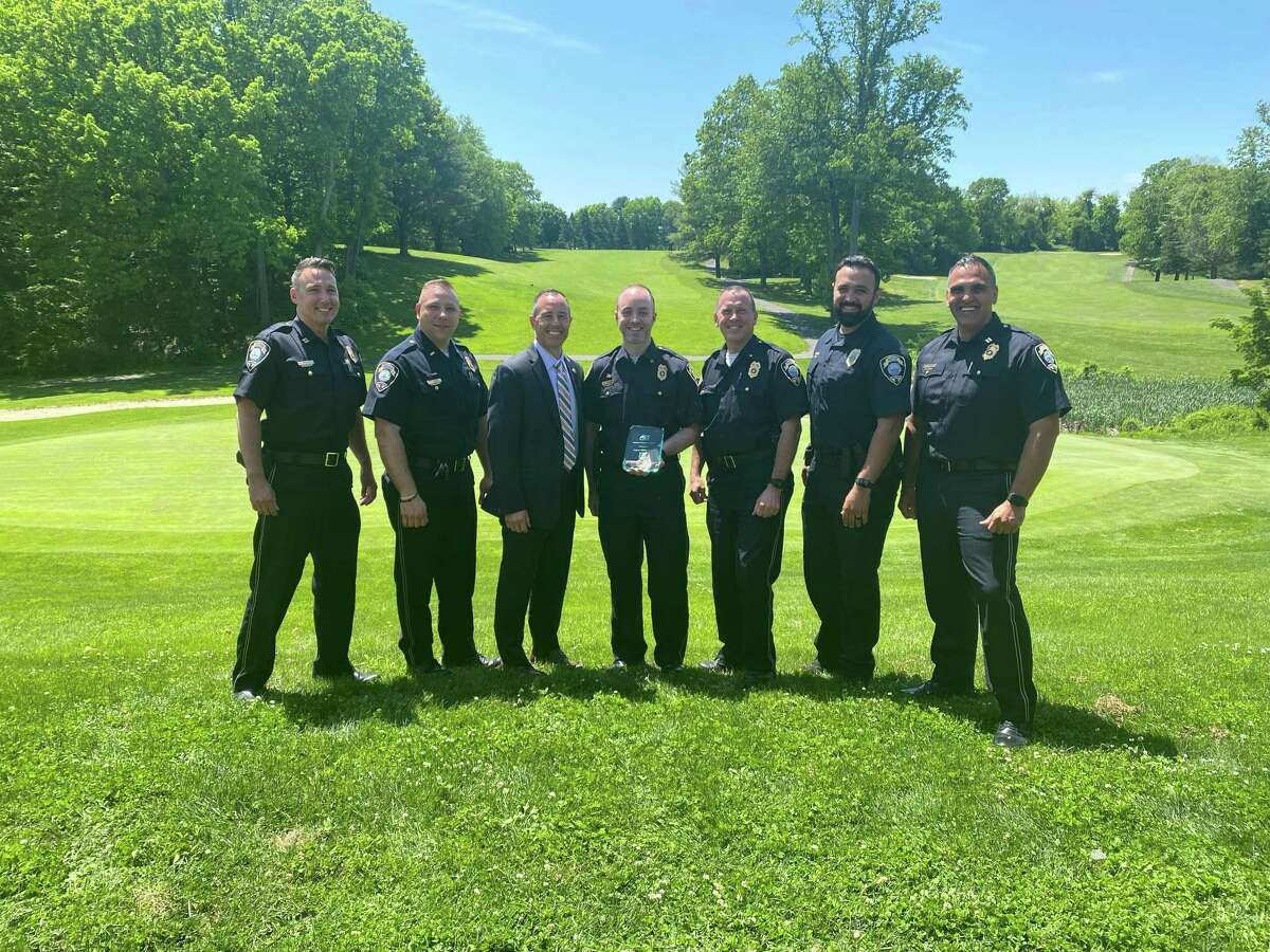 Fairfield police Sgt. Michael Stahl with fellow members of the Fairfield Police Department after accepting an award from the Southern Connecticut Chapter of the American Society for Industrial Security.