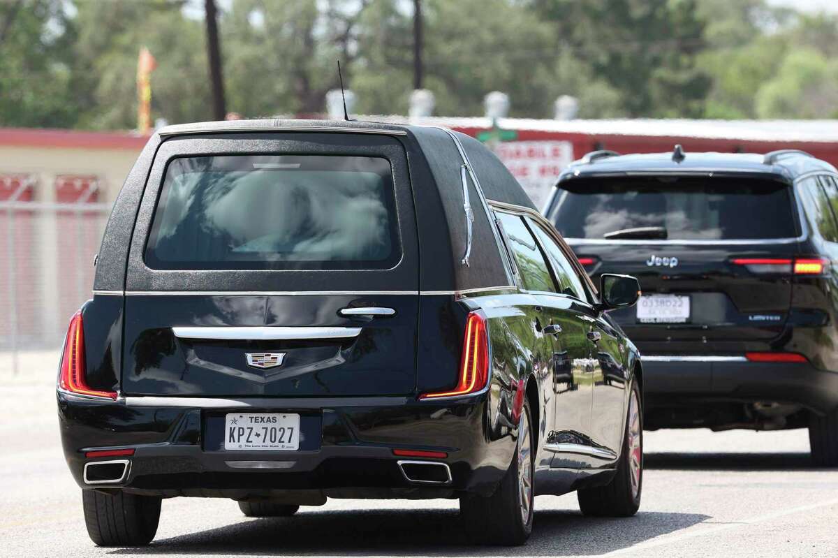 A hearse carries the casket of Robb Elementary School teacher Eva Mireles after a funeral mass Sacred Heart Church in Uvalde, Texas, Friday, June 10, 2022. She was one of 21 murdered in a mass shooting at the school on May 23.