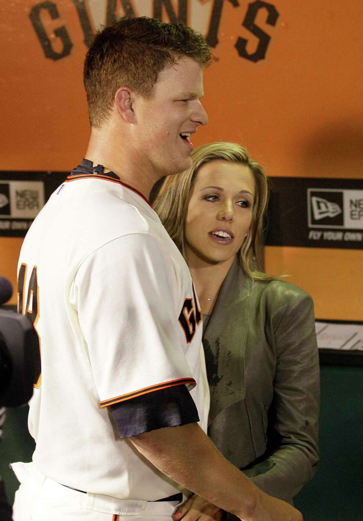 San Francisco Giants pitcher Matt Cain, left, celebrates with his wife Chelsea after a baseball game against the Houston Astros in San Francisco, Wednesday, June 13, 2012. Cain pitched the 22nd perfect game in major league history and first for the Giants, striking out a career-high 14 and getting help from two spectacular catches to beat the Houston Astros 10-0. (AP Photo/Jeff Chiu)