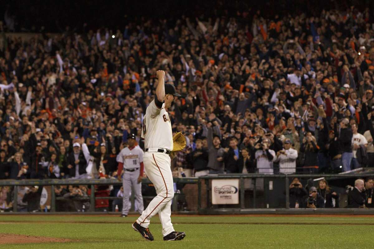 SAN FRANCISCO, CA - JUNE 13: (EDITORS NOTE: Retransmission with alternate crop.) Matt Cain #18 of the San Francisco Giants celebrates after pitching a perfect game against the Houston Astros at AT&T Park on June 13, 2012 in San Francisco, California. The San Francisco Giants defeated the Houston Astros 10-0. Matt Cain struck out a career-high 14 batters, and pitched a perfect game in what was the first in Giants franchise history. (Photo by Jason O. Watson/Getty Images)