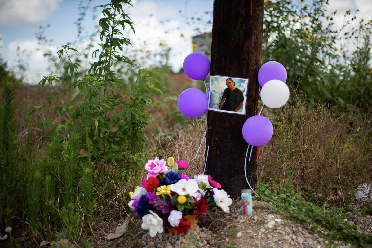 Sajid Barajas’ photograph hangs on a pole by the area where he was killed while he was riding his bicycle from work toward his home at night. Barajas’ family gathered there, Friday, June 10, 2022, in Houston, to share information with the public about his death hoping someone will share knowledge on the circumstances surrounding his death.