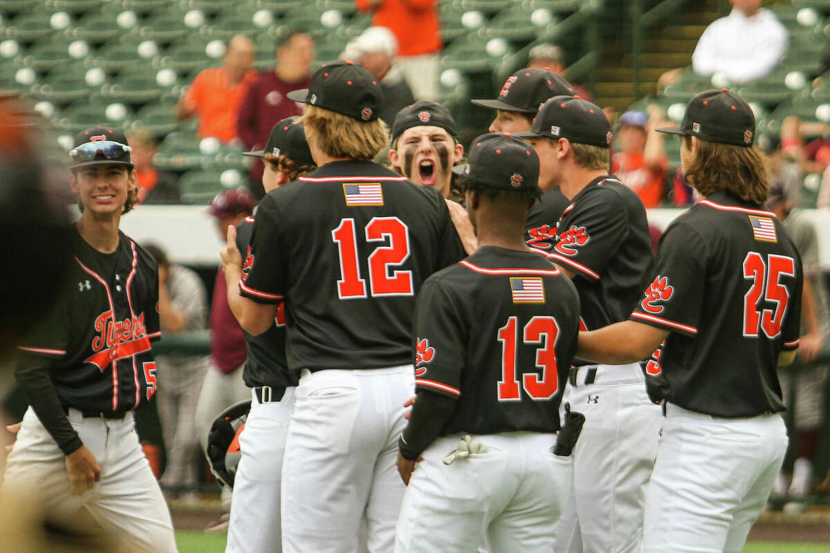 Edwardsville catcher Grant Huebner celebrates after the Tigers 7-4 win over Brother Rice in the Class 4A state semifinal game on Friday at Duly Health & Care Field in Joliet.
