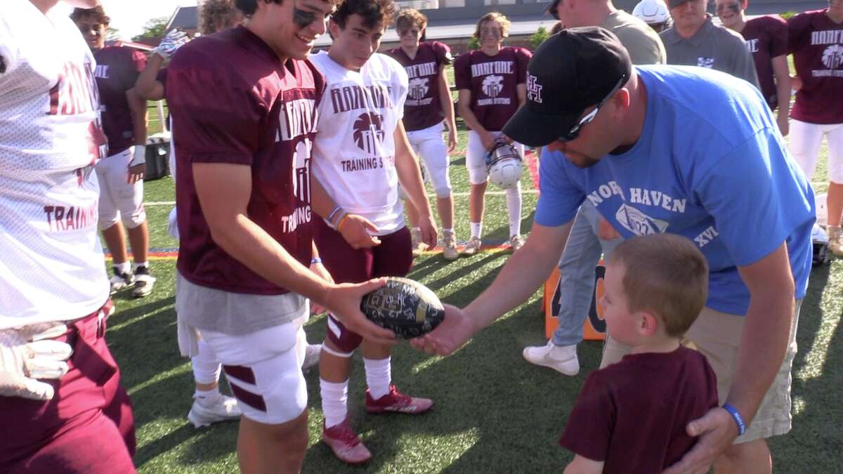 Scenes from the 18th North Haven Spring Brawl football game held at North Haven Middle School Turf Field, Friday, June 10, 2022. The event, run by  North Haven Youth Football, served as a fundraiser for 3-year old Nate Gagne, who has cystic fibrosis.