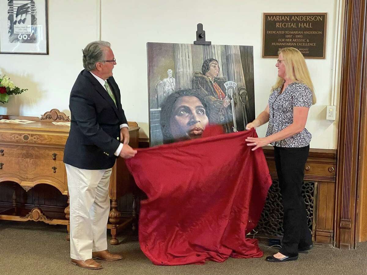 A portrait of former Danbury Music Centre Board of Directors member Marian Anderson has been unveiled. Danbury Mayor Dean Esposito, shown, and Danbury Artist Betty Ann Medeiros, shown, recently unveiled the portrait.