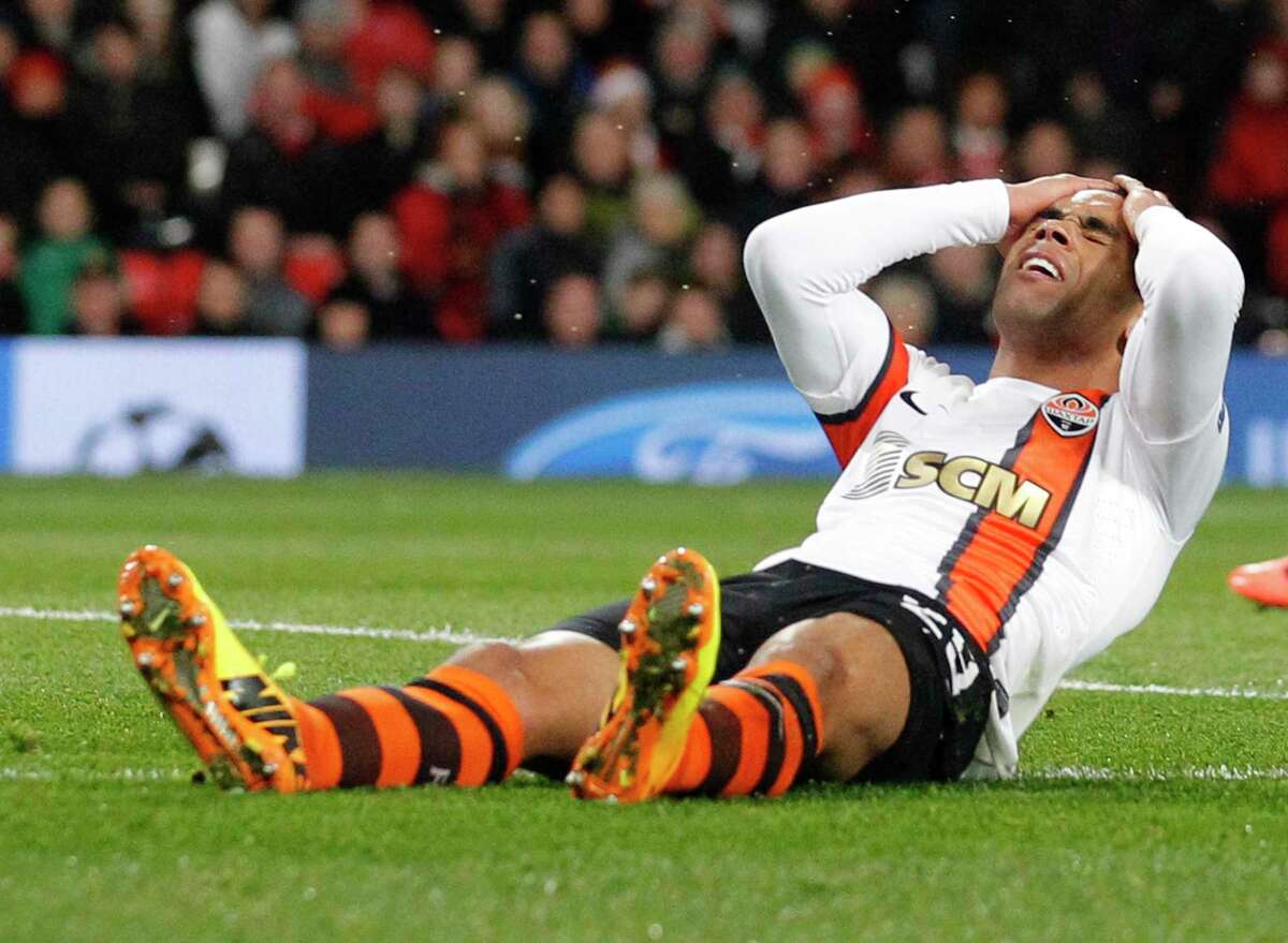 Ukrainian soccer team Shakhtar Donetsk, whose Alex Teixeira reacts after missing a chance to score against Manchester United during a game in 2013, has not been able to play a home match since 2014 because of an armed conflict with Russia.