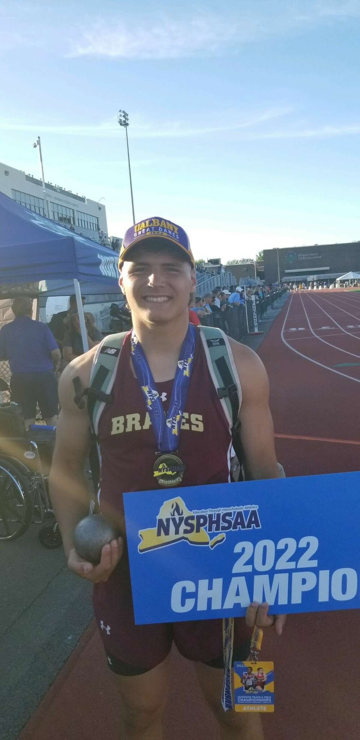 Fonda senior Alessandro Saltsman poses after winning Division II state titles in the shot put and discus. on Friday at the state meet Cicero-North Syracuse.