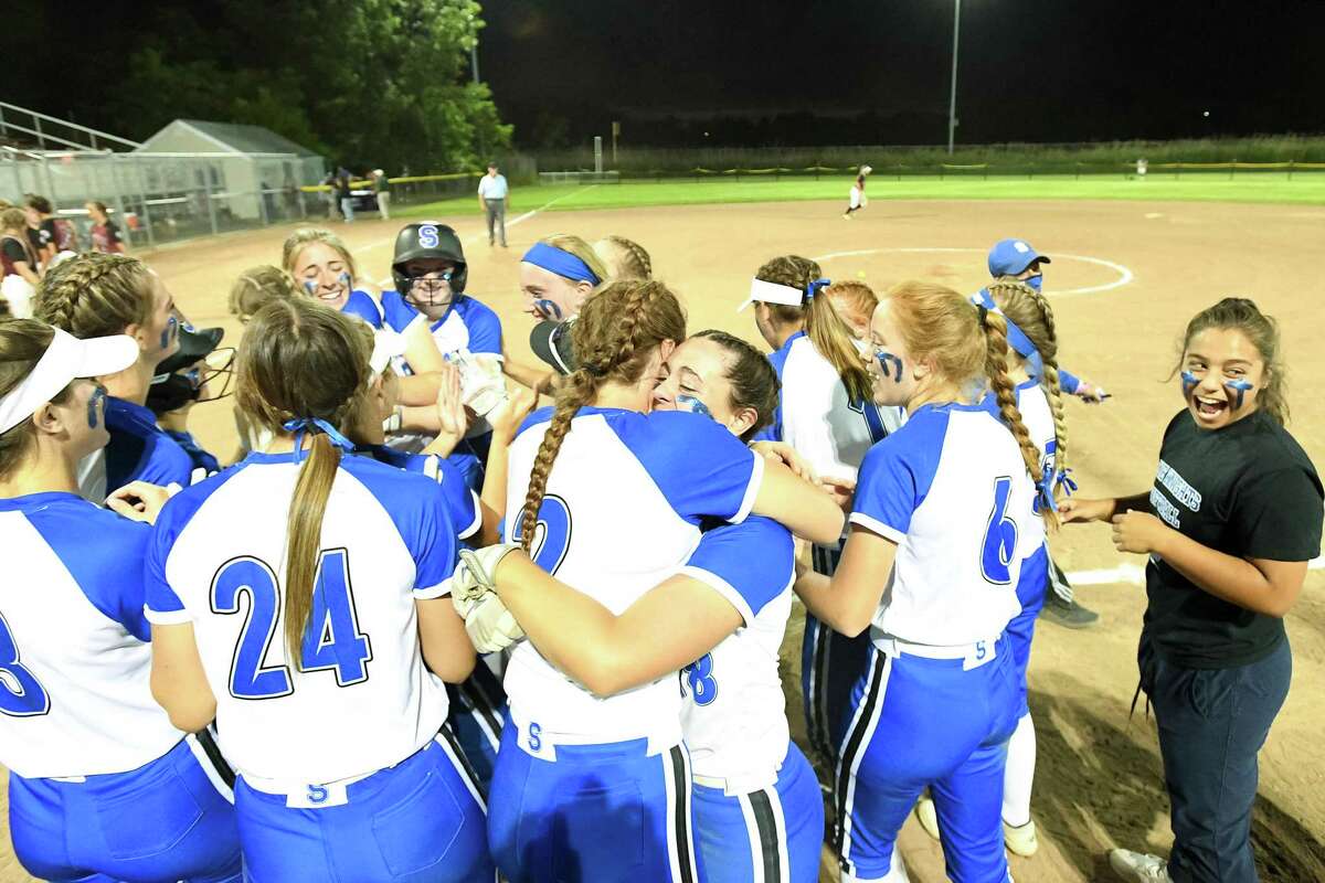 The Southington High celebrates winning the 2022 CIAC Class LL softball championship at DeLuca Field in Stratford, CT.