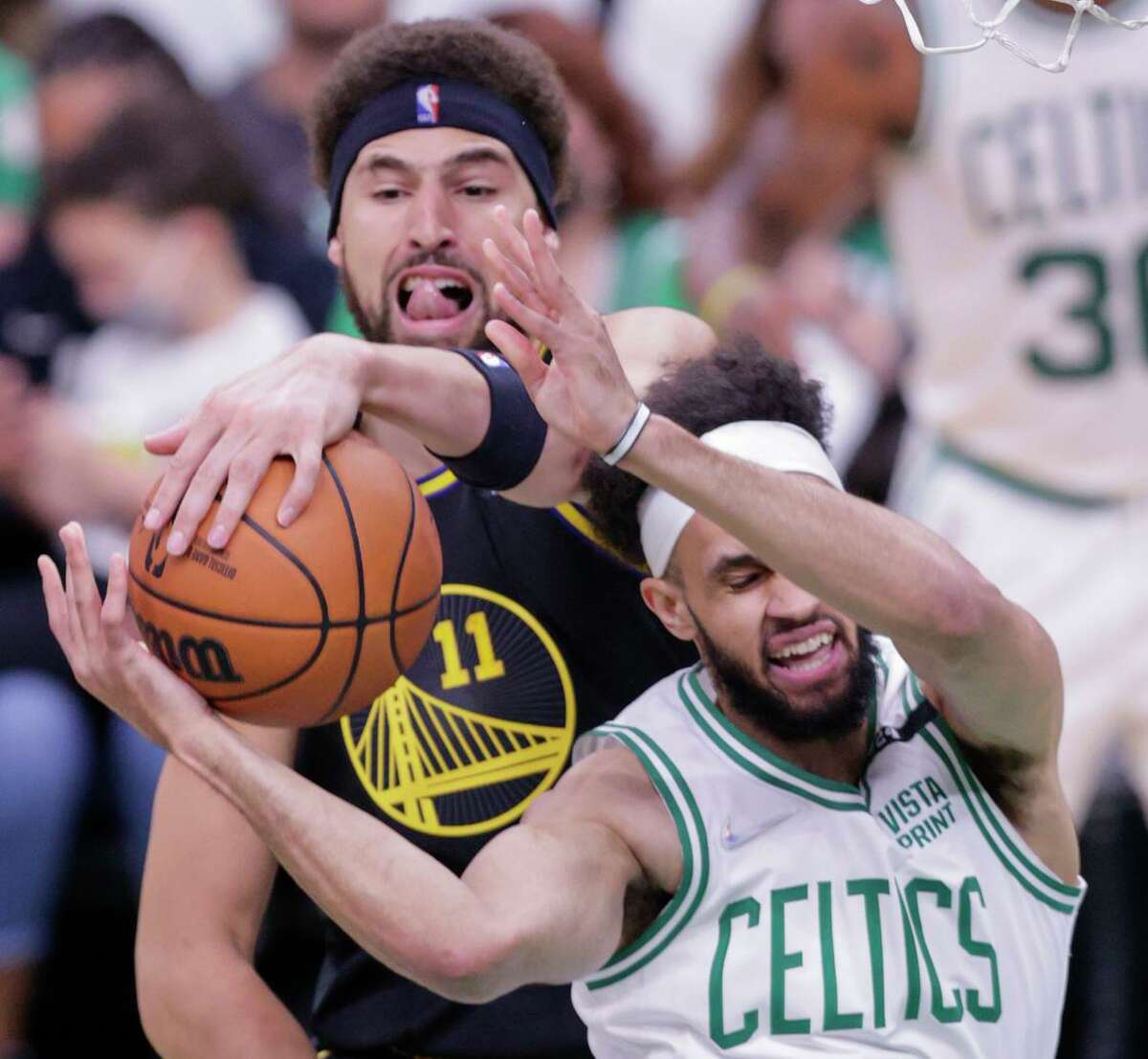 Klay Thompson’s defense against Derrick White (right) and the Celtics played a large part in the Warriors’ Game 4 victory in Boston.