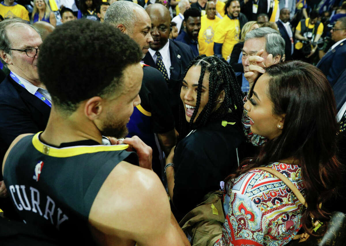 Ayesha Curry smiles at her husband Stephen Curry after the Golden State Warriors win the playoffs at the Oracle Arena on May 16, 2019 in Oakland, California.