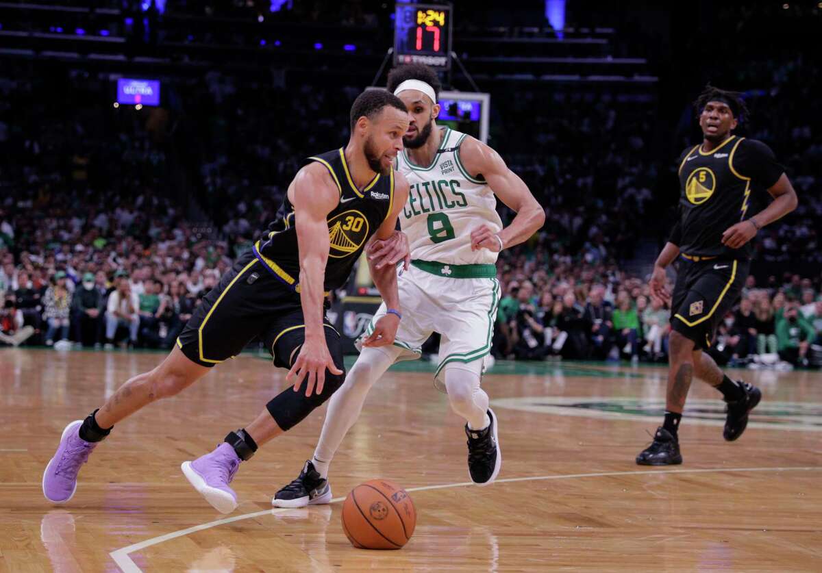 Golden State Warriors' Stephen Curry, 30, tries to get past Boston Celtics' Derrick White, 9, during the second quarter but is call for a foul during the second quarter in Game 4 of the NBA Finals at TD Garden in Boston, Mass., on Friday, June 10, 2022.