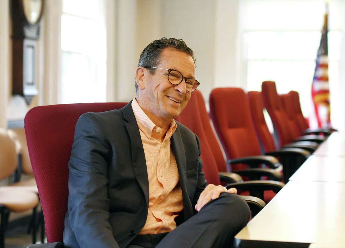 University of Maine Chancellor Dannel Malloy, the former governor of Connecticut, chats in the executive offices at the main campus in Orono, Maine in 2019.
