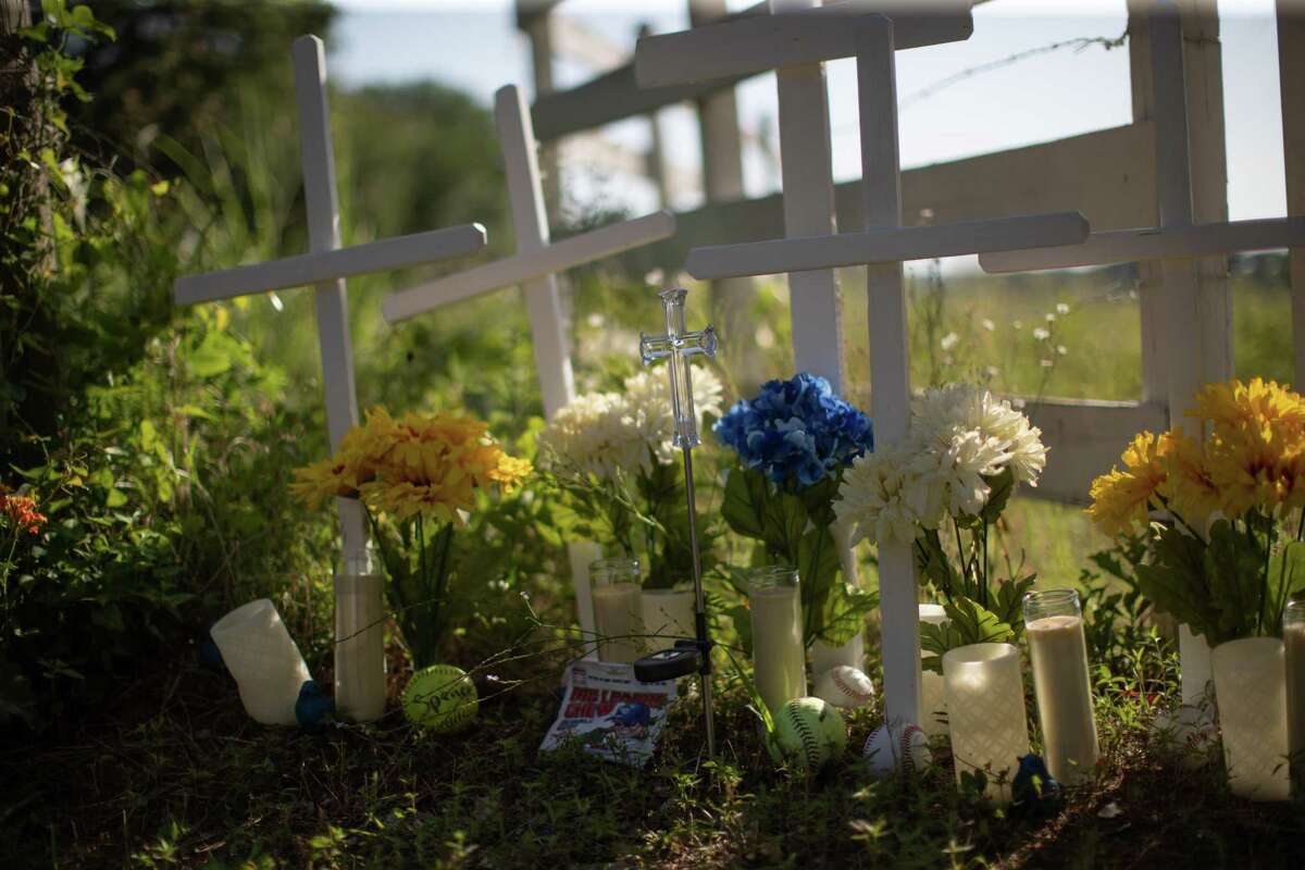 A makeshift memorial has been created to honor the members of the Collins family who were killed by a fugitive in Centerville. The memorial is by the entrance gate of the property were the crimes took place. Tuesday, June 7, 2022.