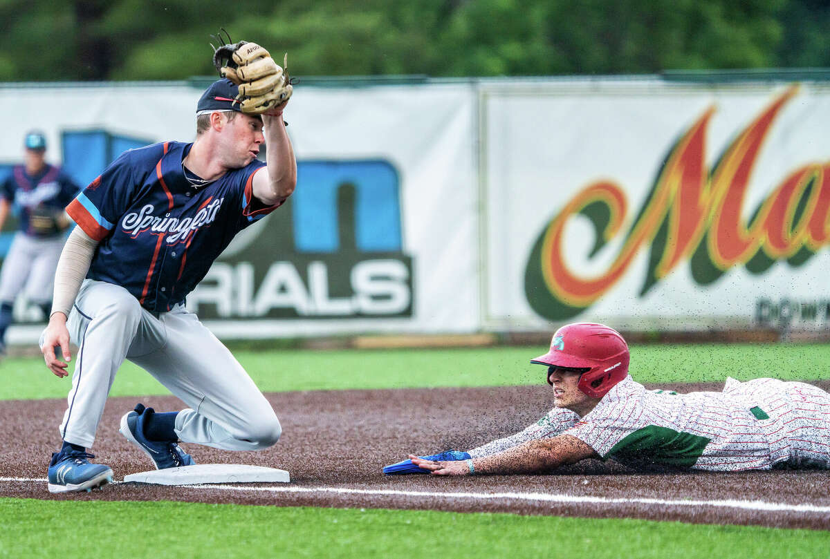 Blake Stenger of the River Dragons, right, steals third base Friday night ahead of a tag from the Springfield Lucky Horseshoes' Johnny Colombo. Stenger was 1-for-3 on the night, with a walk and two runs scored. 
