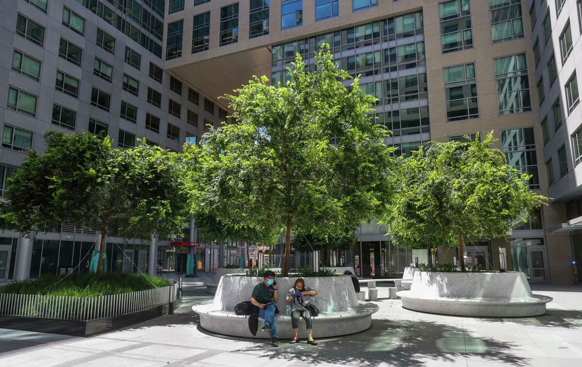 People take a break at Trinity Place’s courtyard in San Francisco.